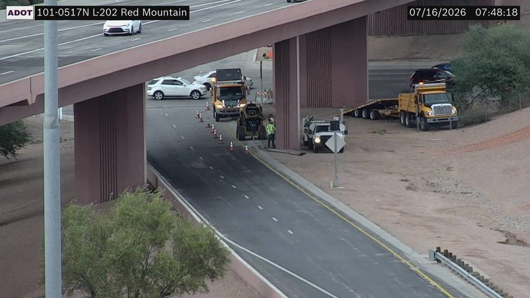 Construction cones and workers in the right lane
