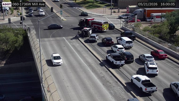 Fire truck and police vehicles blocking the intersection with traffic cones deployed