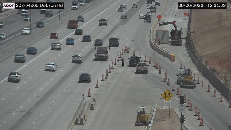 Construction cones and workers in the right lanes