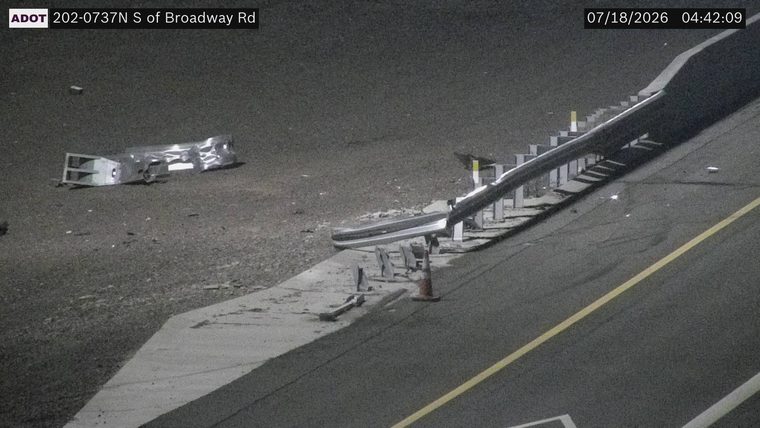 Debris and damaged guardrail on the right shoulder