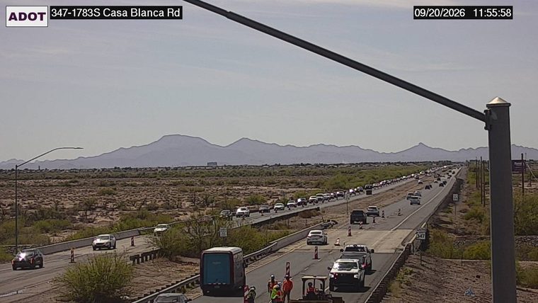 Construction cones and workers in the right lane