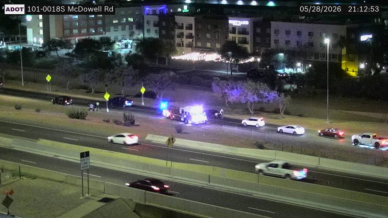 Fire truck with flashing lights on the shoulder