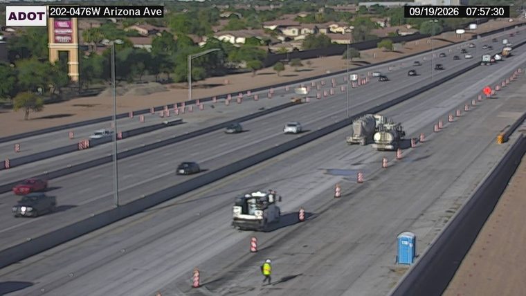 Construction worker and equipment in the right lane
