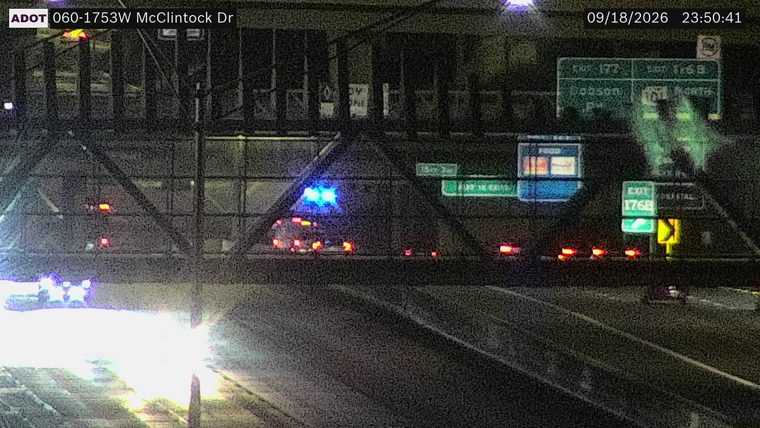 Police car with blue flashing lights on the roadway