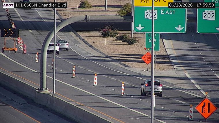 Construction cones and a ramp closed ahead sign in the right lane