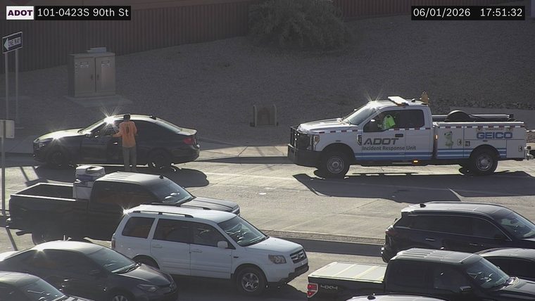 ADOT Incident Response Unit truck and a person standing by a car in the roadway