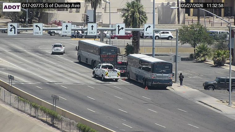 ADOT incident response truck with 'RIGHT LANES BLOCKED' sign and two buses in the right lanes with cones