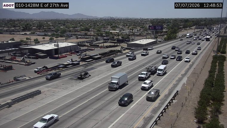 Vehicle on fire in the left lane