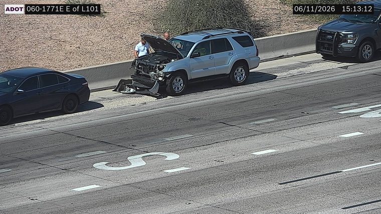 Silver SUV with front-end damage on the right shoulder