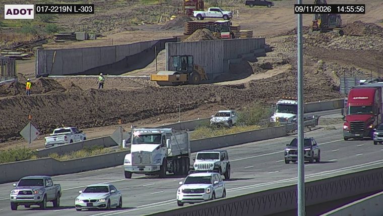White SUV with significant front-end damage on the right shoulder