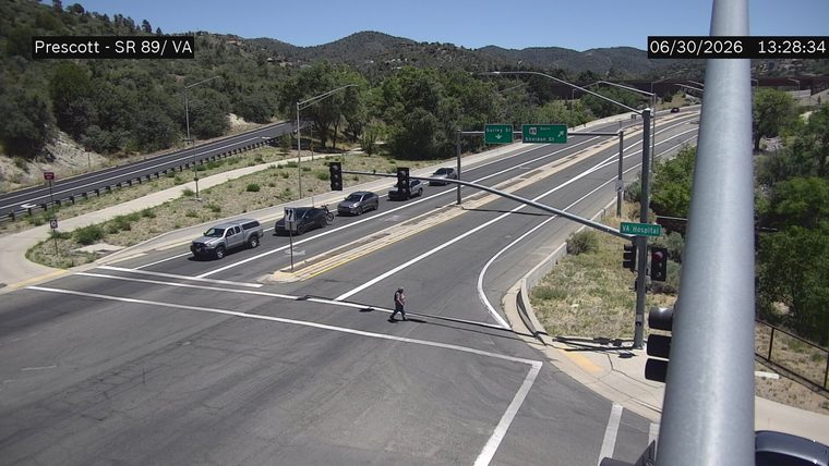 Person crossing the street in the crosswalk