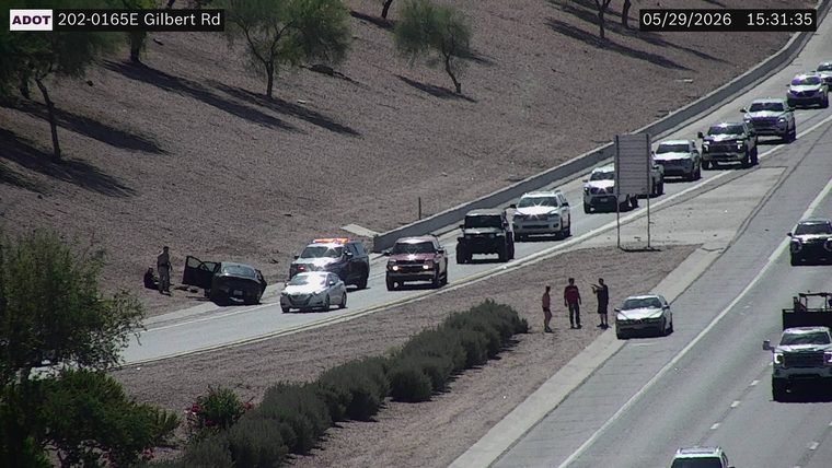 Police car with lights on the shoulder
