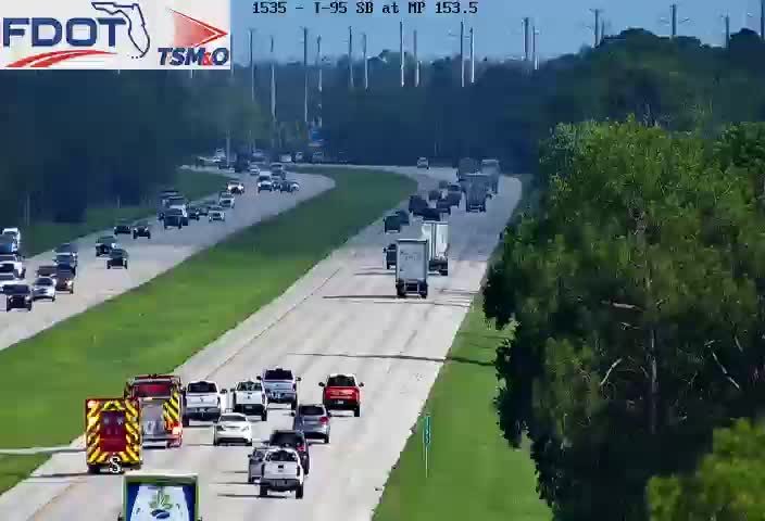 Fire truck and ambulance on the right shoulder
