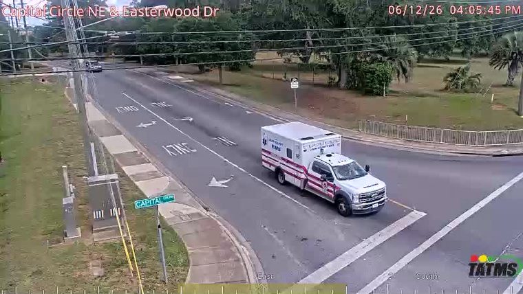 An EMS vehicle is present on the roadway.