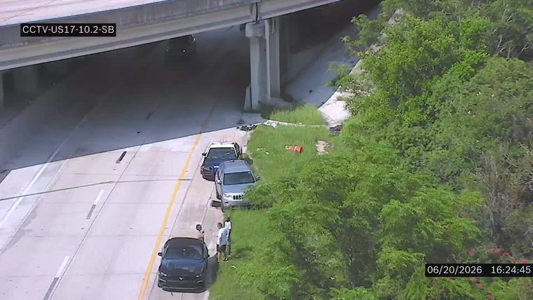 Police car and two other vehicles on the right shoulder