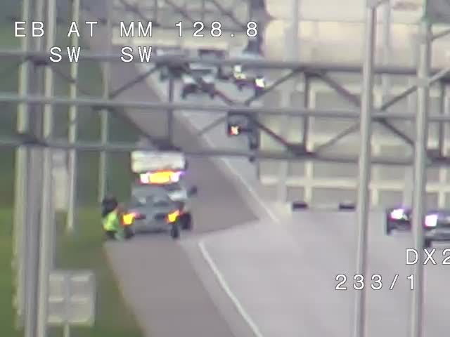 Police car with lights on the shoulder