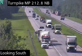 Emergency responder with cones on the shoulder of Turnpike MP 212.8 NB.