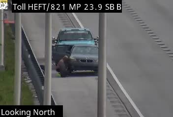 Two vehicles involved in a crash on the highway, one appears to be a BMW.