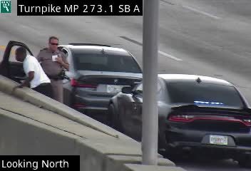 Police car with lights on the shoulder
