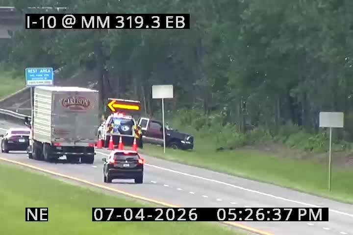 Police car with lights on the shoulder