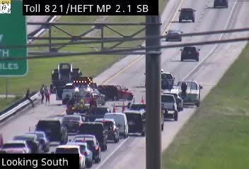 Multiple emergency vehicles and personnel on the roadway