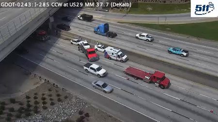 Ambulance and several other vehicles stopped in the left lanes