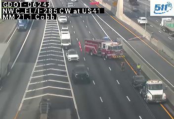 Fire truck with red and blue lights on the right shoulder