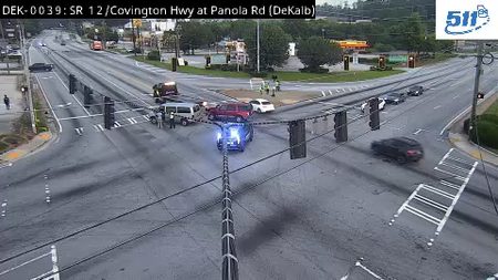 Police car with blue lights on in the intersection