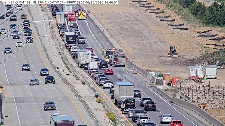 Fire truck and other emergency vehicles with lights on in the left lanes