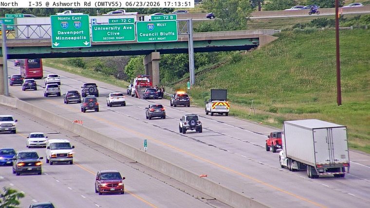 Police car with lights on the right shoulder