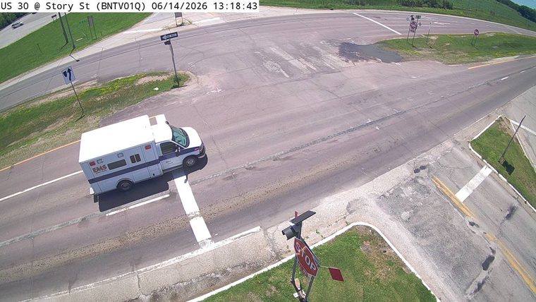 An EMS vehicle is present at the intersection.