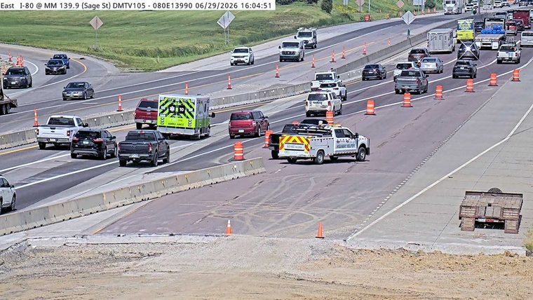 Highway Helper vehicle and an ambulance on the right side of the roadway