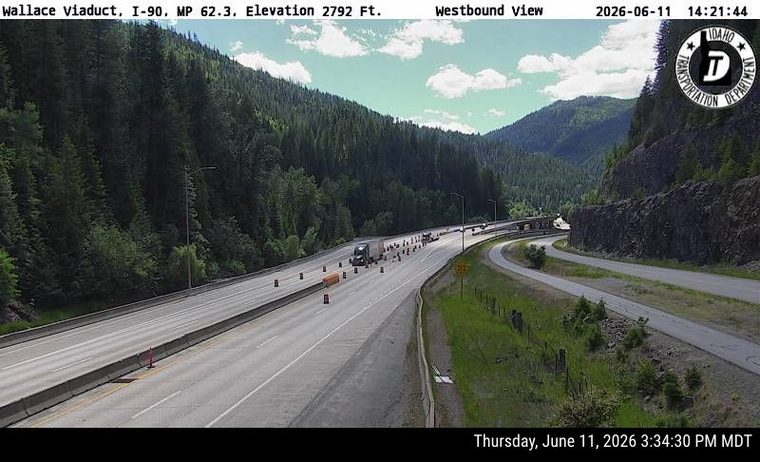 Traffic cones and a truck indicate a possible work zone or incident response.