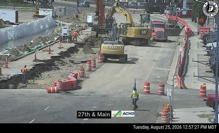 Construction cones and workers in the roadway
