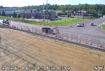 Police car and construction barriers on the road.
