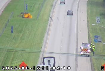 Emergency responders and vehicle on the side of the highway.