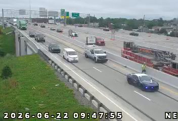 Fire truck and police car with lights on the right shoulder