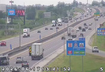 Emergency responder and vehicle on the shoulder of the highway.