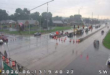 Construction vehicles and cones indicate ongoing road work or an incident response.