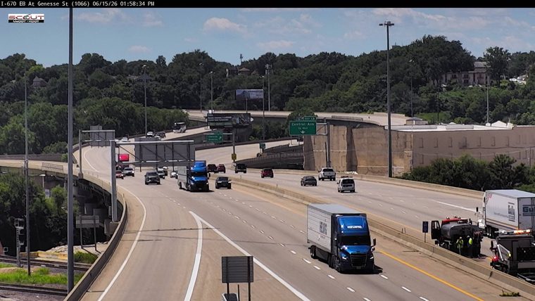 Emergency responders and equipment are on the shoulder of the highway.