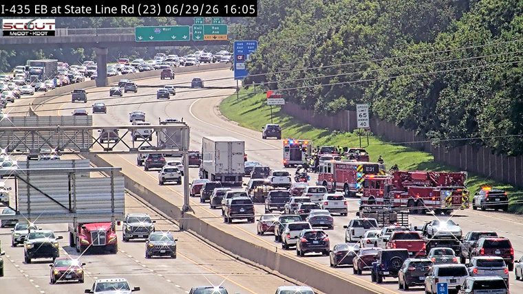 Fire truck and ambulance with emergency lights on the right shoulder