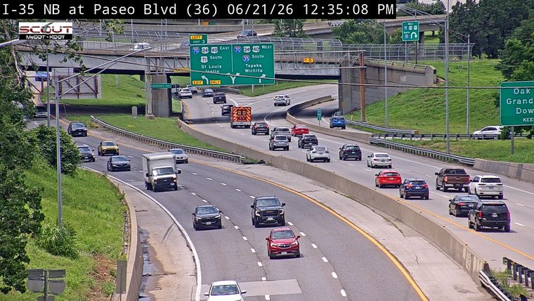 Ambulance with lights on in the left lane