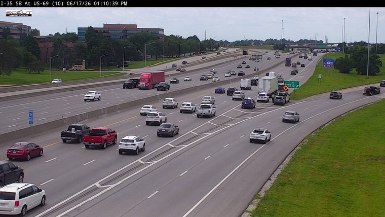 Police and tow truck responding to an incident near the exit ramp.