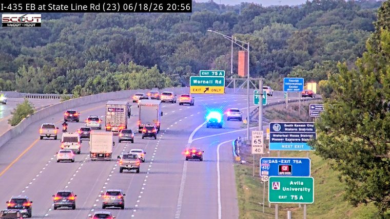 Police car with blue and red lights on the roadway