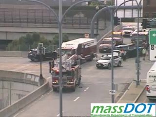 Fire truck and other vehicles on the roadway, indicating an incident response.