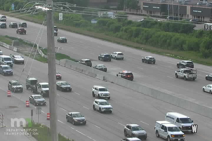 Police car with lights on the right shoulder