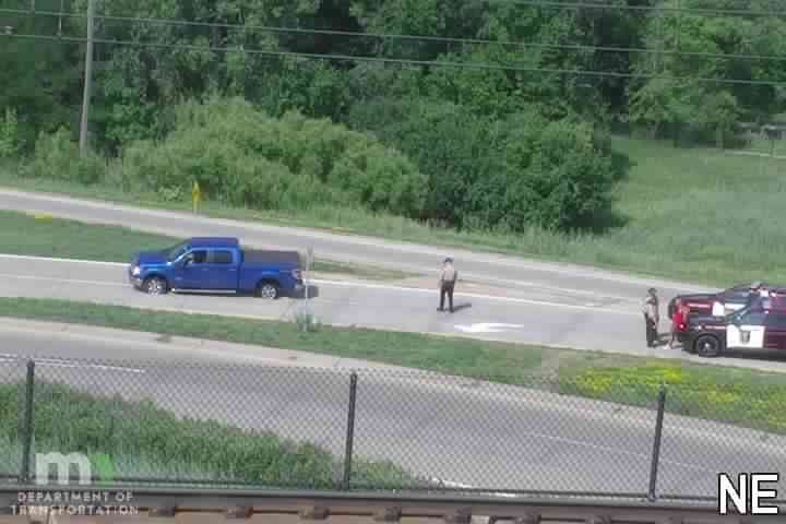 Police car with lights on the shoulder