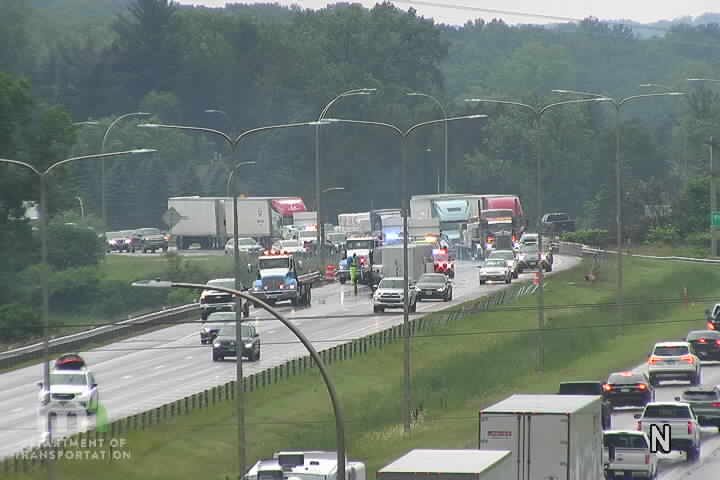 Multiple emergency vehicles and personnel in the roadway