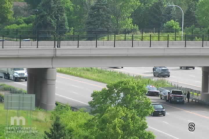 Police car with lights on the right shoulder