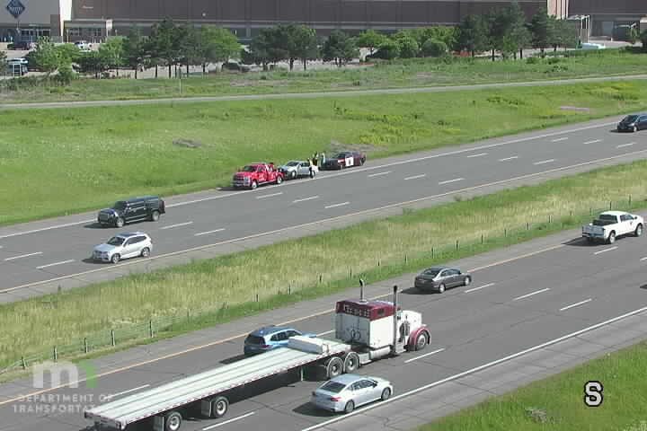 Police and tow truck responding to an incident on the roadside.